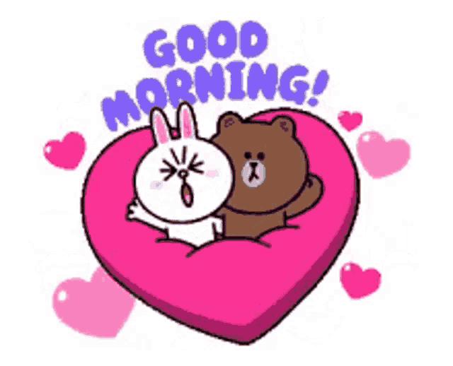 a brown bear and a white rabbit laying on a pink heart