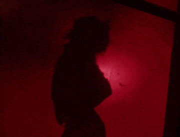 a red light is shining on a red surface