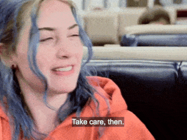 a woman with blue hair is sitting in a diner and says take care then