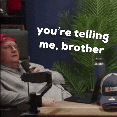 a man sitting in front of a microphone with the words " you 're telling me brother " written on the screen