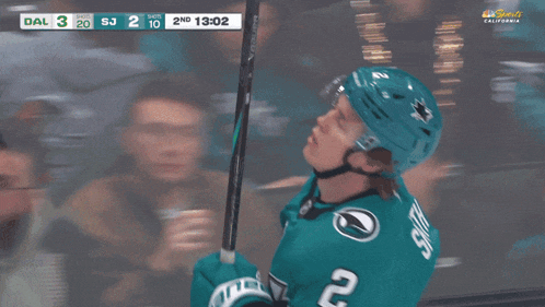a hockey player celebrates a goal during a game