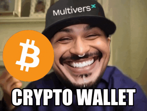 a man wearing a multivers hat holds up a bitcoin