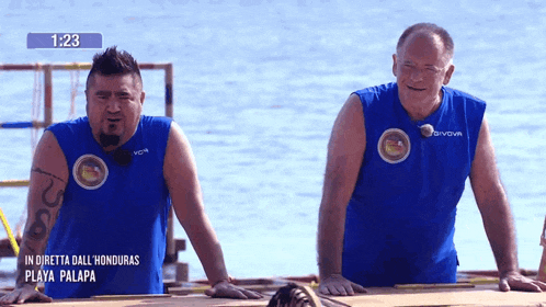 two men wearing blue shirts with givova on the front