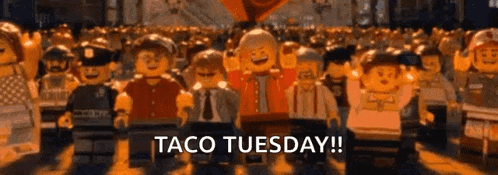 a group of lego figures are walking down a street with the words taco tuesday