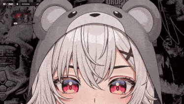 a close up of a girl wearing a teddy bear hat that says 3:36