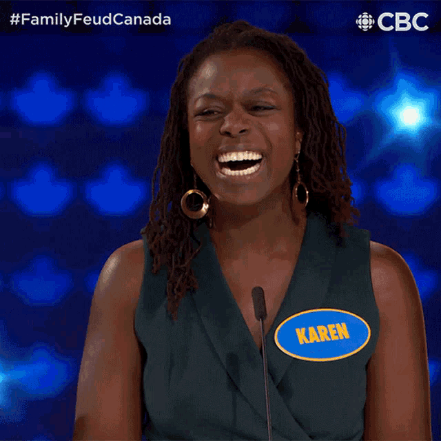a woman wearing a name tag that says karen on it