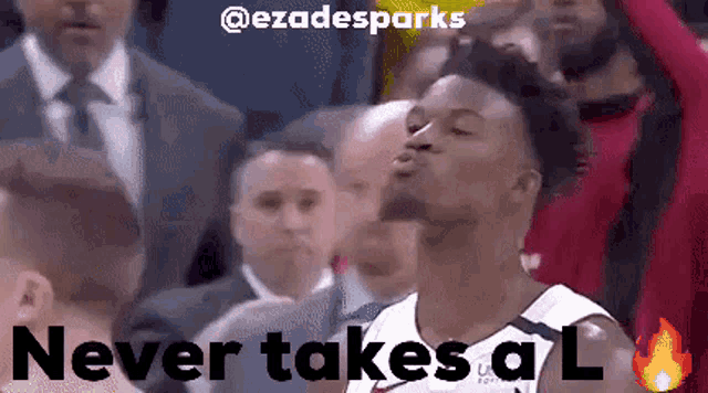 a basketball player blowing a kiss with the words never takes a l above him