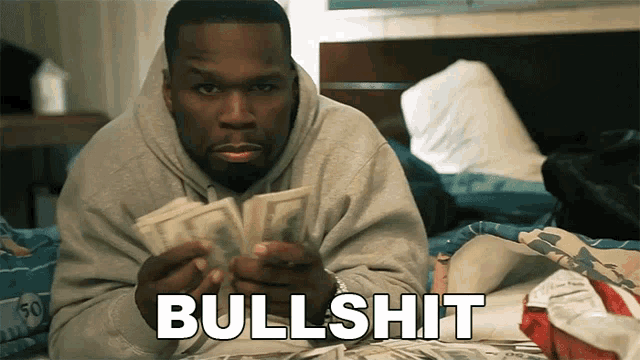 a man is laying on a bed holding a pile of money and the word bullshit is visible