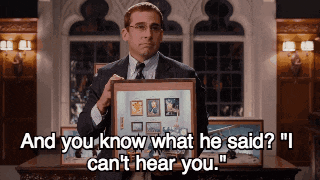 a man in a suit and tie is holding a framed picture with the words " and you know what he said ? "