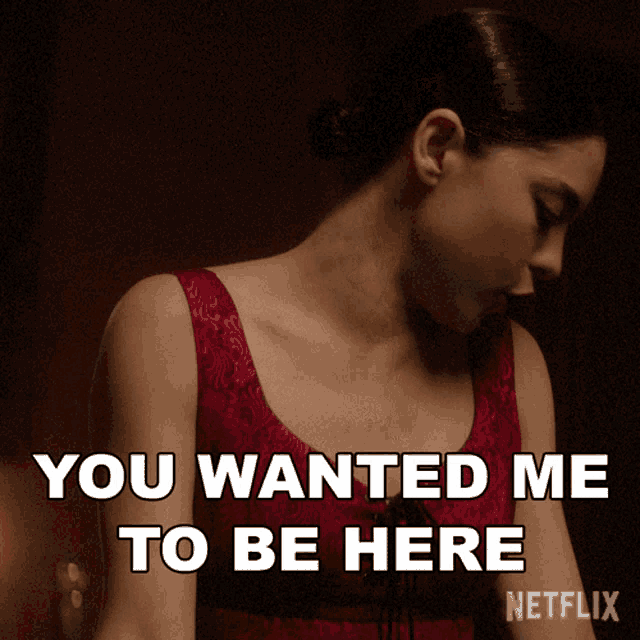 a woman in a red top says you wanted me to be here