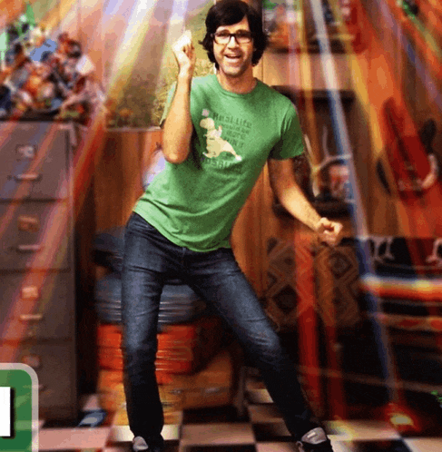a man wearing a green shirt that says ' muscles ' on it