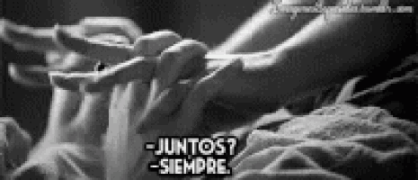 a black and white photo of a couple holding hands with the words juntos siempre in the corner .
