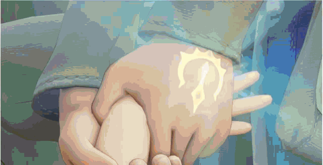 a person holding another person 's hand with a symbol on their palm