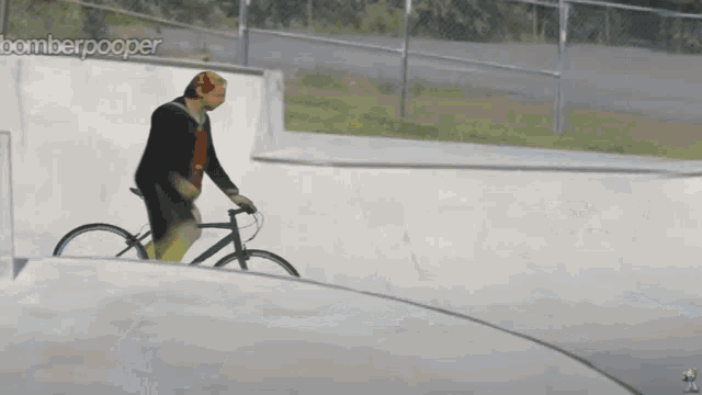 a man wearing a mask is riding a bike on a ramp with bomberpooper written on the bottom right