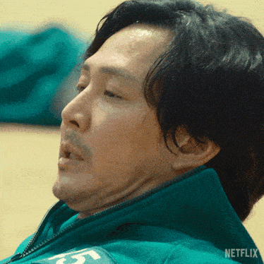 a close up of a man 's face with netflix written on the bottom