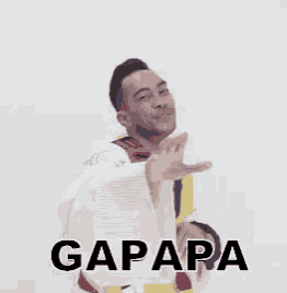 a man in a colorful jacket is making a funny face with the word gapapa written above him .