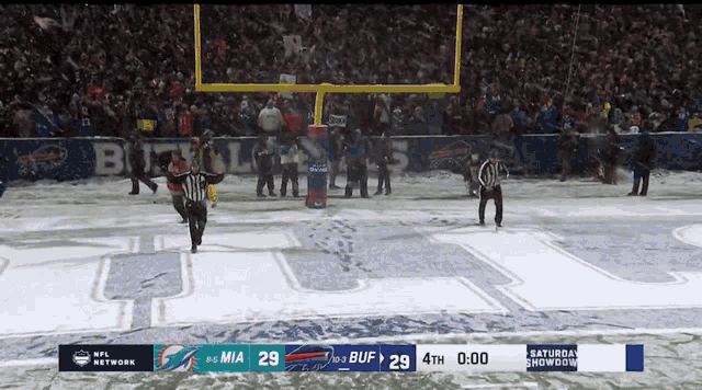 a football game is being played on a snowy field