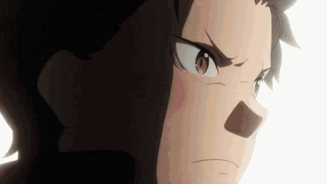 a close up of a person 's face with a serious look on his face