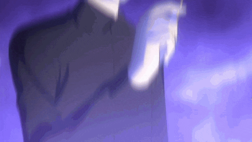 a man in a suit is standing in front of a purple background