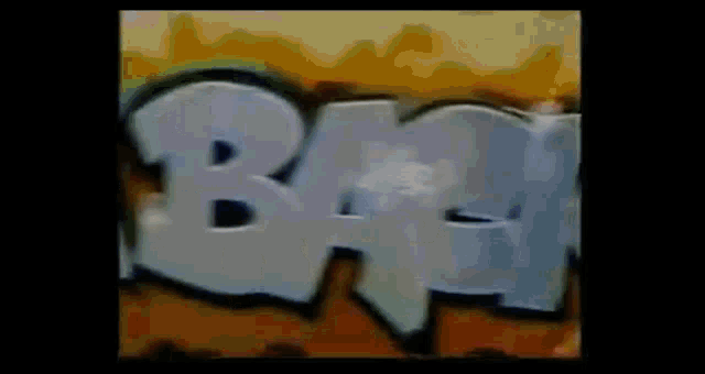 the word bam is painted on a wall in graffiti style