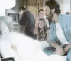 a blurry picture of a group of people sitting on a couch