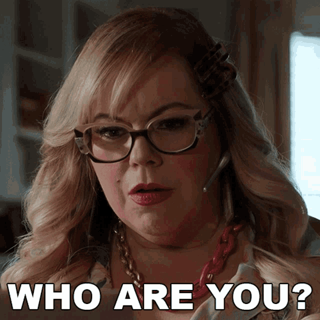 a woman wearing glasses and a headset is asking who are you
