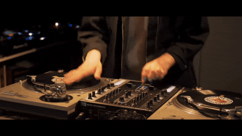 a person playing a record on a turntable that says ' pioneer ' on it