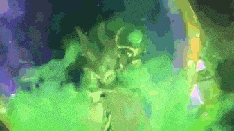 a green and purple background with a statue of a deer in the foreground