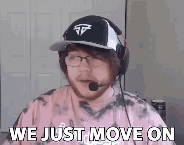 a man wearing glasses and a hat with the words we just move on