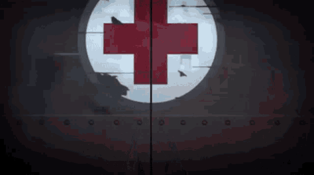 a red cross in a circle with a hole in the middle
