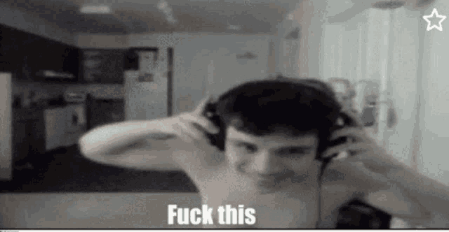 a shirtless man wearing headphones with the words " fuck this " on the bottom