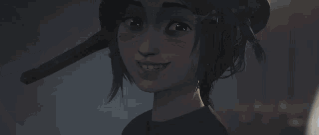 a close up of a person 's face in a dark room with a light coming out of it .
