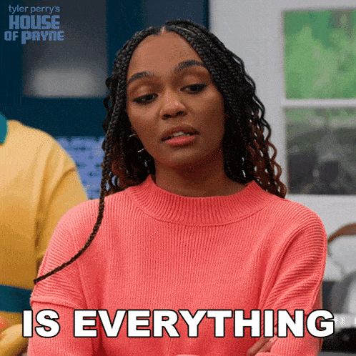 a woman in a pink sweater is saying is everything