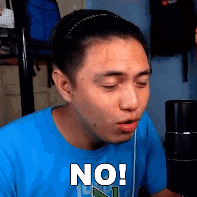 a man wearing a blue shirt says no