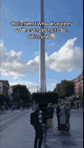 that friend who disagrees with everything to be different is standing next to a tall tower