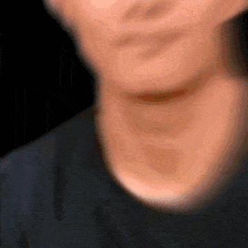 a close up of a person 's neck and face