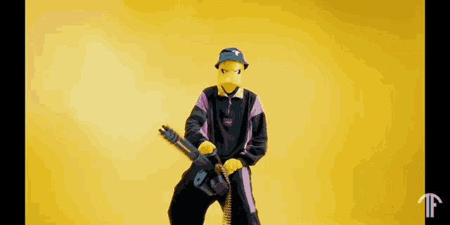 a man in a cartoon costume is holding a gun and a flamethrower .