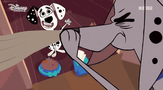a dalmatian dog is playing with a rope and a disney channel logo can be seen in the corner