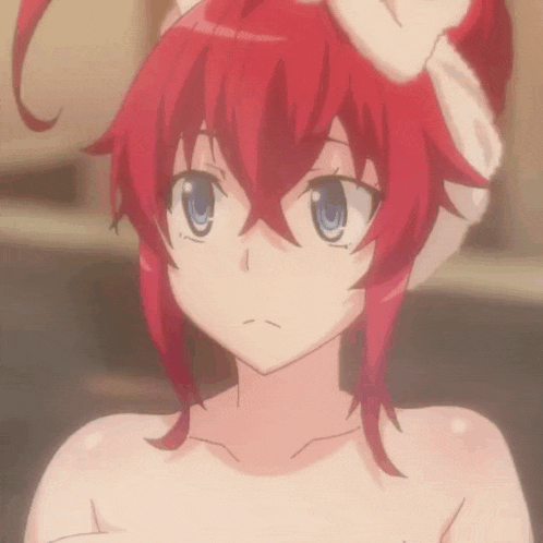 a naked anime girl with red hair and blue eyes looks at the camera