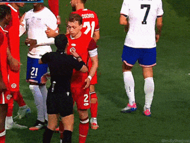 a soccer player with the number 21 on his shirt