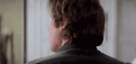 a close up of a man 's back with a blurred background .