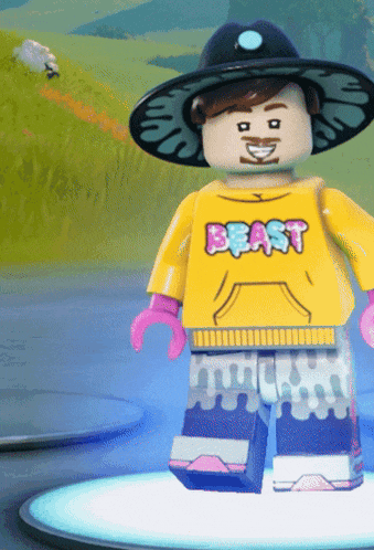 a lego figure wearing a hat and a yellow shirt with the word beast on it