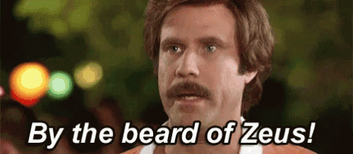 a man with a mustache is saying by the beard of zeus !