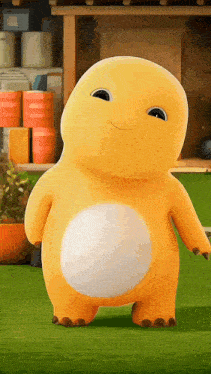 a yellow stuffed animal with a white belly is standing on a lush green field
