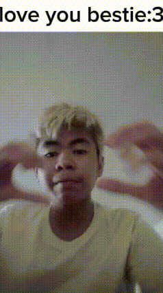 a man is making a heart shape with his hands and says `` i love you bestie : 3 ''
