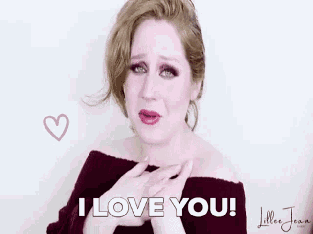 a woman is crying and saying `` i love you '' with a heart in the background .