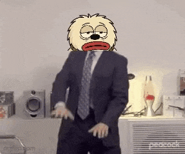 a man in a suit and tie is dancing with a cartoon head on his head .