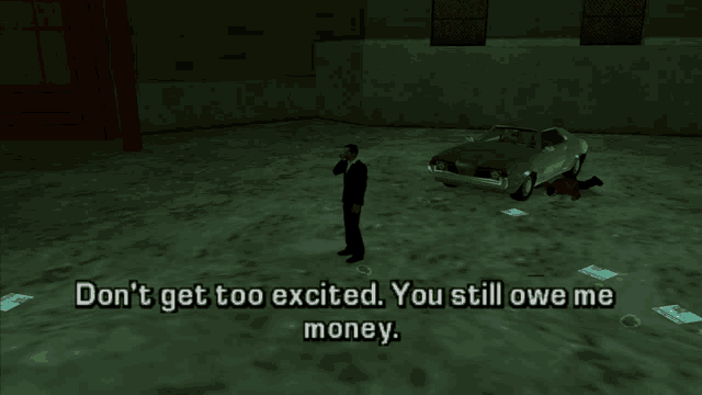 a man in a suit stands in front of a car and says " don t get too excited you still owe me money