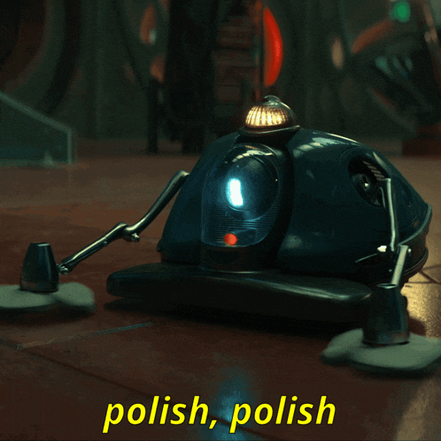 a polish polish robot is sitting on a wooden floor