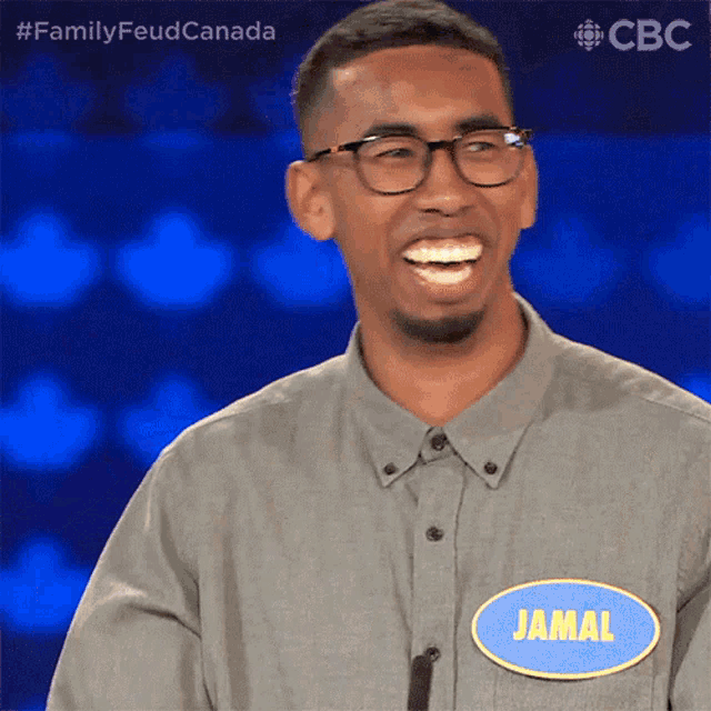 a man wearing glasses and a name tag that says jamal on it